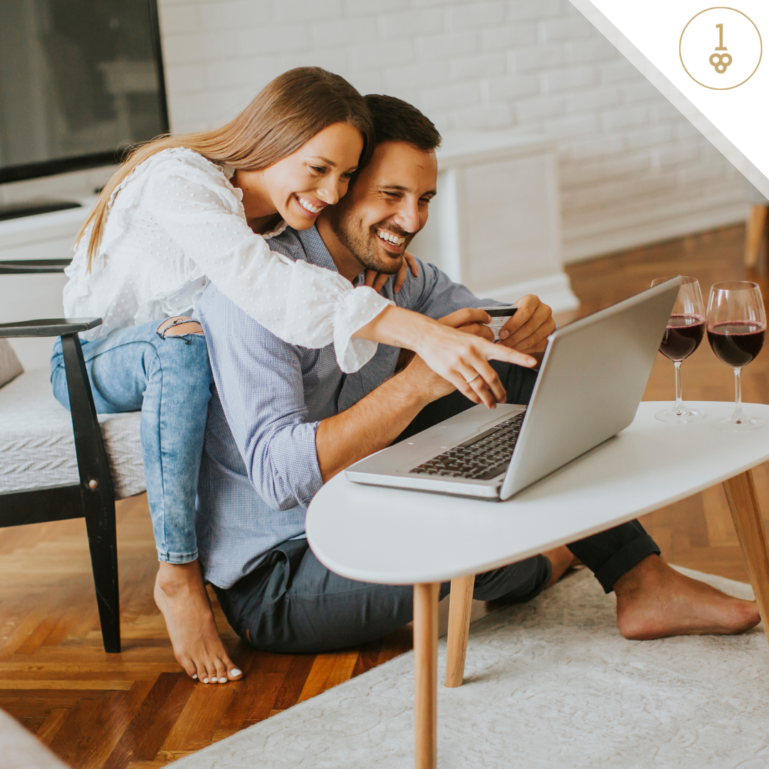 couple wine glasses laptop